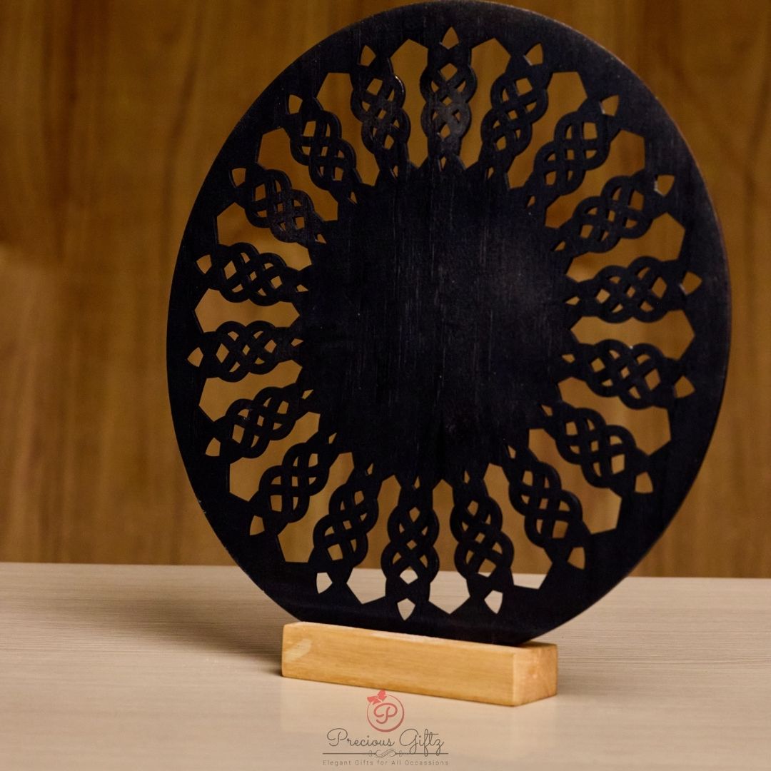 Laser-cut wooden charger plate on stand, black lattice design