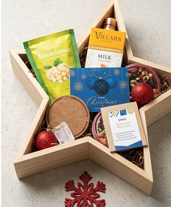 Star-shaped wooden corporate gift tray with coasters, cookies, macadamia nuts and wine chocolates