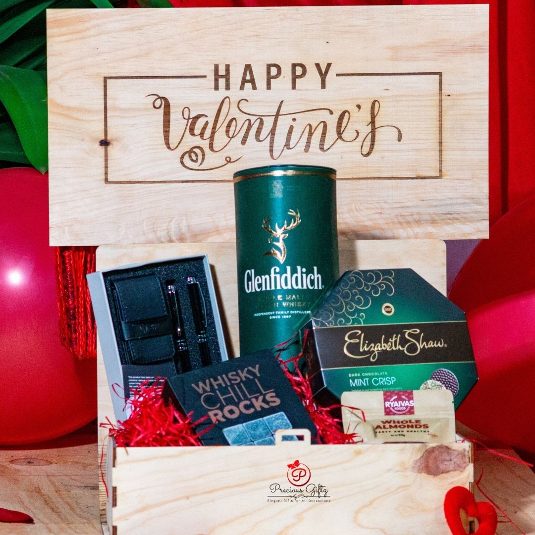 Precious Giftz branded wooden Valentine's hamper crate with whisky, chocolates and gift set