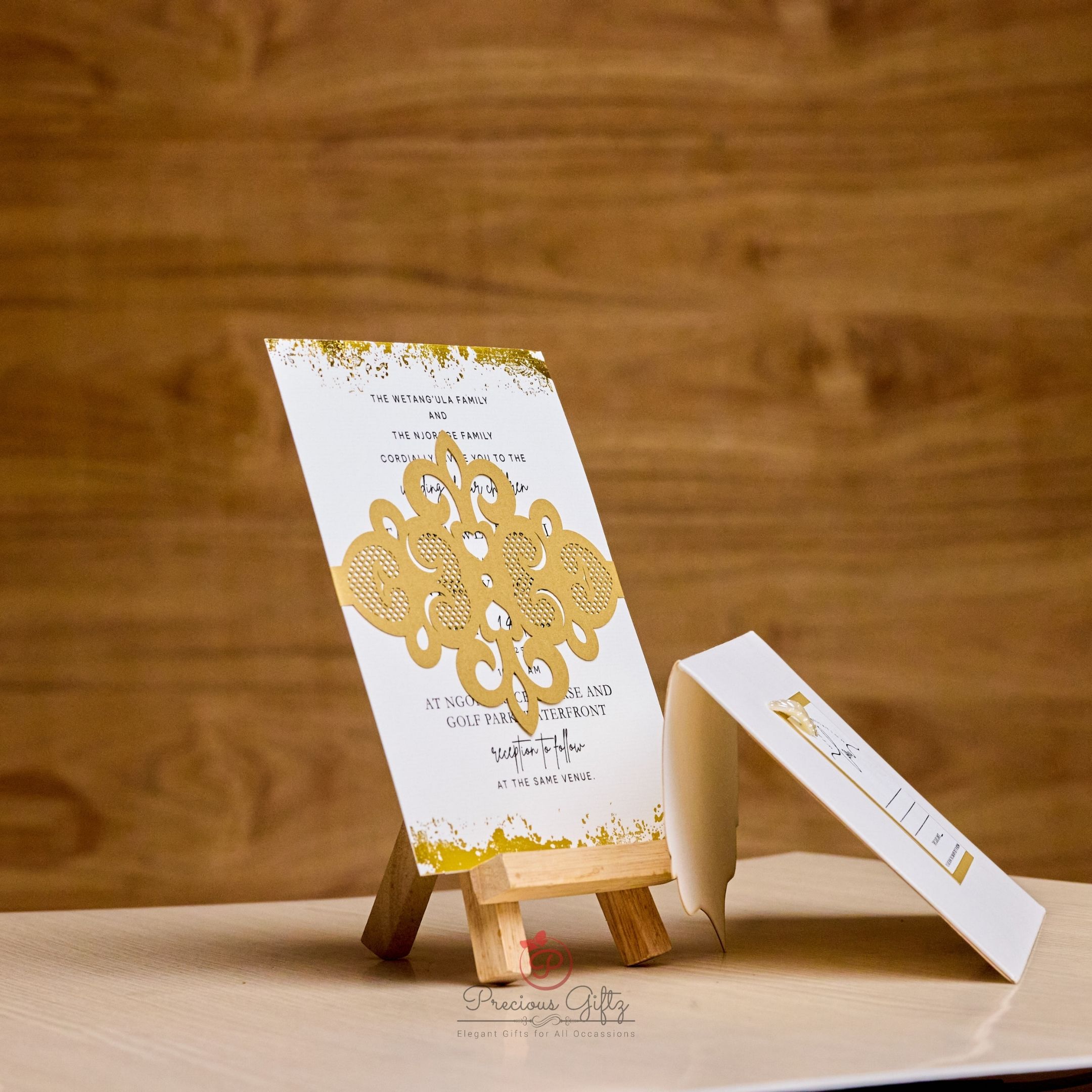 Gold laser-cut fleur wedding invitation with admit card